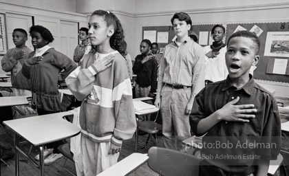 Jehova's Witness Ryan McCabe stands silently during pledge of allegiance in his public school. The Supreme Court ruled in 1943 that one of the things the American flag stands for is the right not to salute it. New York City, 1991.