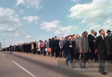 Crossing over: King leads the Montgomery-bound marchers over the Edmund Pettus Bridge, which was already famous for shocking scenes of police brutality,   Selma,  Alabama.  1965
