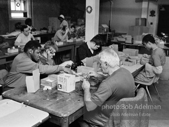 Ex Mental Patients in Halfway House working, assembling pens,.as part of rehabliitation program. Brooklyn,  NY, 1972.