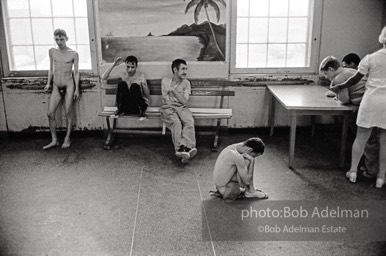 Common Room, Willowbrook State School. After a 1972 television expose revealed naked and neglected retarted children living amongst filth and disease, civil-liberties lawyers began a ground-breaking suit that led to unprecedented rights for children with disabilities. Staten Island, New York, 1974.