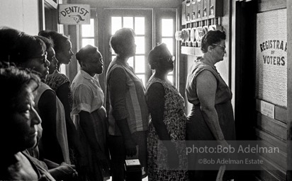 A study in impatient patience, voter applicants line up then wait — and wait and wait — to register,  Registrar of Voters office, Clinton, East Feliciana Parish, LA 1964