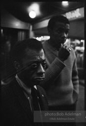 James Baldwin and Jerome Smith outside Junior's Bar in New York City. 1964.