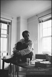 James Baldwin in the office area of his upper west side apartment at the time of production of his play 'Blues for Mr. Charlie'. 1964.