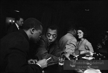 James Baldwin having a drink with his brother at a Broadway bar,  New York City.  1965

“Many who saw Jimmy on television remember him as a scold. But if you knew him, he was the most tender, affectionate friend.  He warned America that we were on the brink of racial chaos and we must find our way back to each other — hopefully through love. He could preach. And could he ever write. In a not-totally-sober moment, he confided that he became a writer because he thought he was ugly: The only way he could communicate with people was if they didn’t see him. Paradoxically, he became one of the most visible writers in the world, and nobody appreciated the irony of that more than Jimmy.”