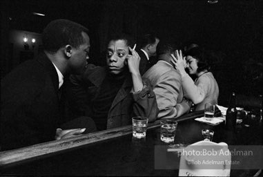 James Baldwin having a drink with his brother at a Broadway bar,  New York City.  1964.