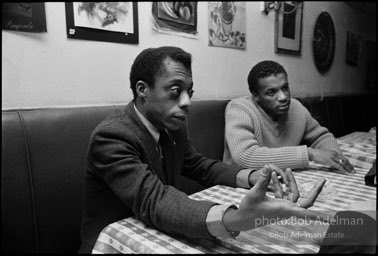 James Baldwin and Jerome Smith at Junior's Bar on 52nd Street near the ANTA theater where Baldwin's 'Blues for Mr. Charlie' is in production. 1964.