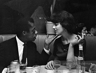 James Baldwin and school teacher (not idetified) at El Toro's restaurant. 1964.