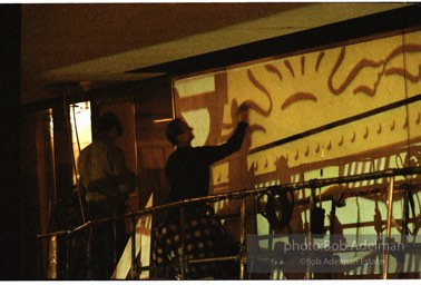 From Mural with Blue Brushstroke. New York City, 1985-86photo©Bob Adelman estate. Artwork©Estate of Roy Lichtenstein.