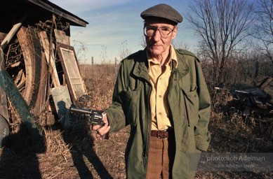 Internationally renowned author  William Burroughs , famed BEAT writer, shooting target practice. In his youth he 