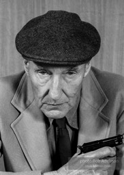 Internationally renowned BEAT writer William Burroughs poses with a gun. He famously 