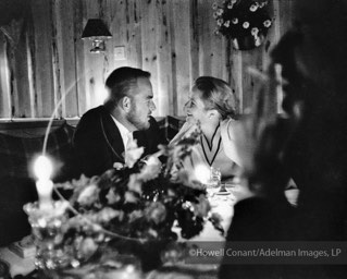 The royal couple share a romantic dinner, 1957
