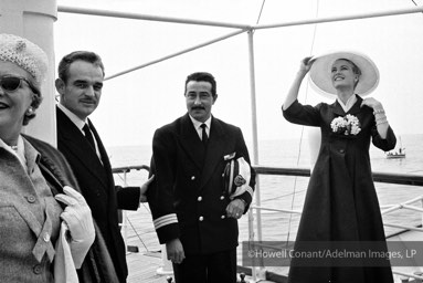 Because the Constitution was too large to dock in the yacht basin, His Serene Highness, Prince Rainier III, came out on his yacht, the Deo Ju- vante II, to greet his bride. Monaco, April 12, 1956