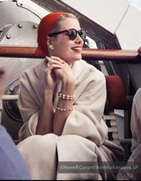 Grace Kelly relaxing with family and friends aboard the Constitution. April, 1956.