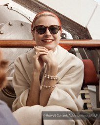 Grace Kelly relaxing with family and friends aboard the Constitution. April, 1956.