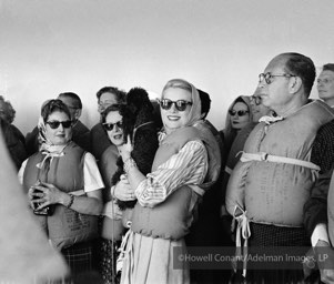 Grace Kelly with fellow passengers during the Muster Drill as the Constitution prepares to set sail. April, 1956.
