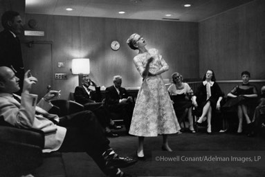 Charades Night on board the Constitution with Grace Kelly dramatizing the phrase 
