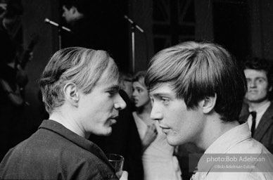 Andy Warhol and Gino Piserchio at a party. New York City, 1965