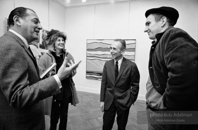 The art collector Bob Scull talks with Mr. and Mrs. Tom Wessselmann and Leo Castelli at the Leo Castelli Gallery, NYC, 1965