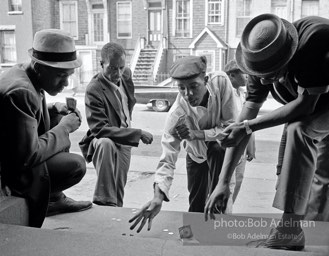 Shooting craps, Brooklyn, New York City.  1963