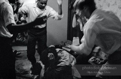 Damage control: Congress of Racial Equality volunteers, most of them students, are taught to protect themselves if attacked during a peaceful protest, Columbus, Ohio.  1962