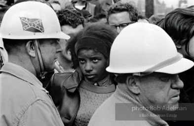 Hard stare: A young woman penned in by Sheriff Jim Clark’s posse glares as her fellow demonstrators chant, “No more Jim Clark over me,”  Selma,  Alabama.  1965