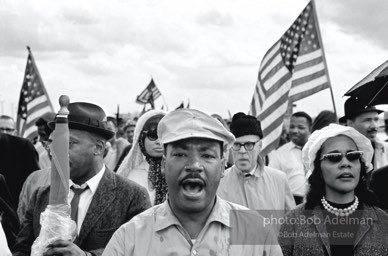 Glory bound: King and his wife, Coretta, lead the marchers on Jefferson Davis Highway en route to Montgomery,  Alabama.  1965