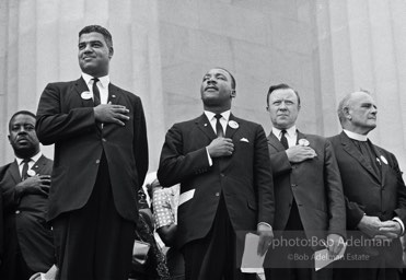 Above: Leaders including the Reverend Ralph Abernathy (far left) and National Urban League Director Whitney Young Jr. (left) join King to pledge allegiance at the beginning of the ceremony at the Lincoln Memorial, Washington,  1963