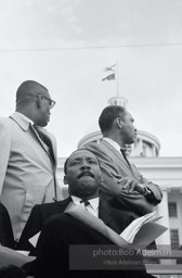 King gazes out at the crowd then prepares his speech, Montgomery,  Alabama.  1965