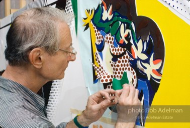 Roy Lichtenstein works on his painting 'Reflection on Interior with Girl Drawing