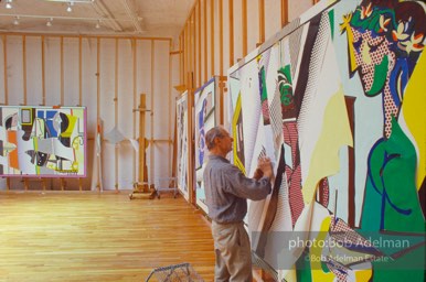 Roy Lichtenstein works on his painting 'Reflection on Interior with Girl Drawing