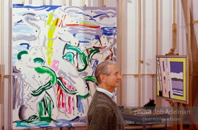 Roy Lichtenstein works on his Reflections series of paintings- Laocoon in background. 1989. photo:©Bob Adelman Estate, Artwork©Estate of Roy Lichtenstein