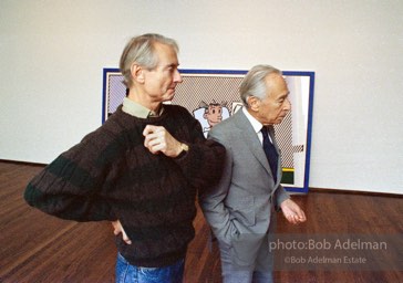 Reflections series. Leo Castelli and Roy Lichtenstein at Castelli Gallery, New York City. 1989. photo:©Bob Adelman Estate, Artwork©Estate of Roy Lichtenstein