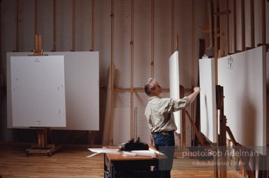 Roy Lichtenstein begins work on his Reflections series of paintings. 1989 photo:©Bob Adelman Estate, Artwork©Estate of Roy Lichtenstein
