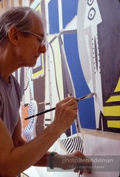 Roy Lichtenstein at work on his painting 