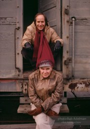 The authors Raymond Carver and Richard Ford seated on an abandoned railroad car in Port Angeles, Washington, 1987.