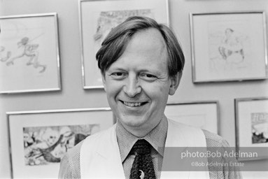 1975- Tom Wolfe in his New York City apartment on the Upper East Side in front of a wall of his drawings.
