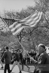 Marchers and onlookers, both for and against the war in Vietnam. Near Central Park in New York City.