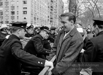 Marchers and onlookers, both for and against the war in Vietnam. Near Central Park in New York City.