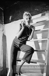 Edie Sedgwick on the steps leading
to Billy Name’s sleeping quarters
at the Factory. 1965.