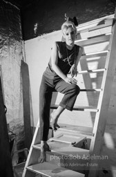 Edie Sedgwick on the steps leading
to Billy Name’s sleeping quarters
at the Factory. 1965.
